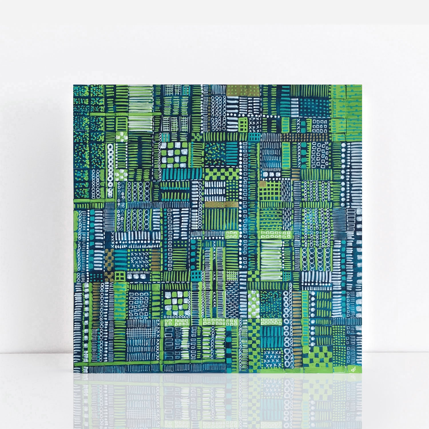 green woven paper painting with language of dots, lines, and circles