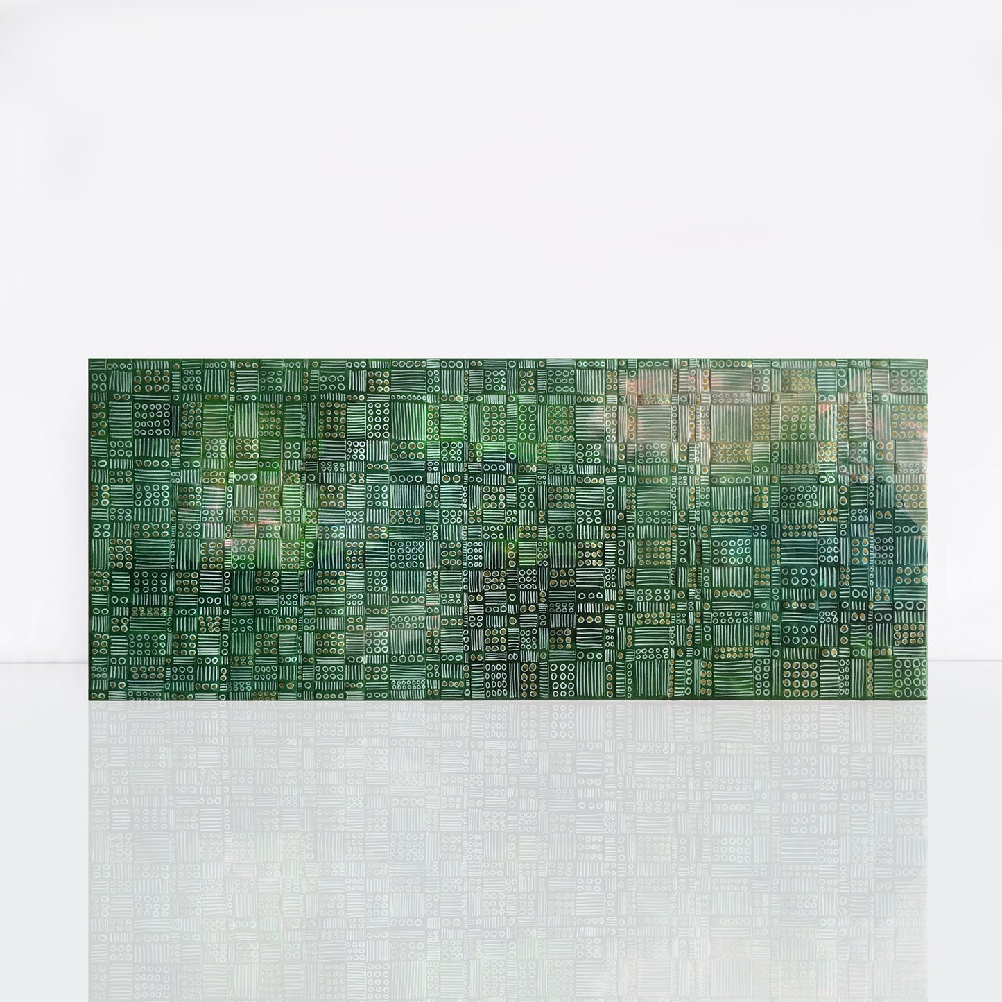 Woven strips of recycled paper have been wrapped around a light weight canvas and painted with green with gold details