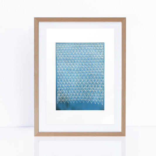 blue artwork in frame with line patterns