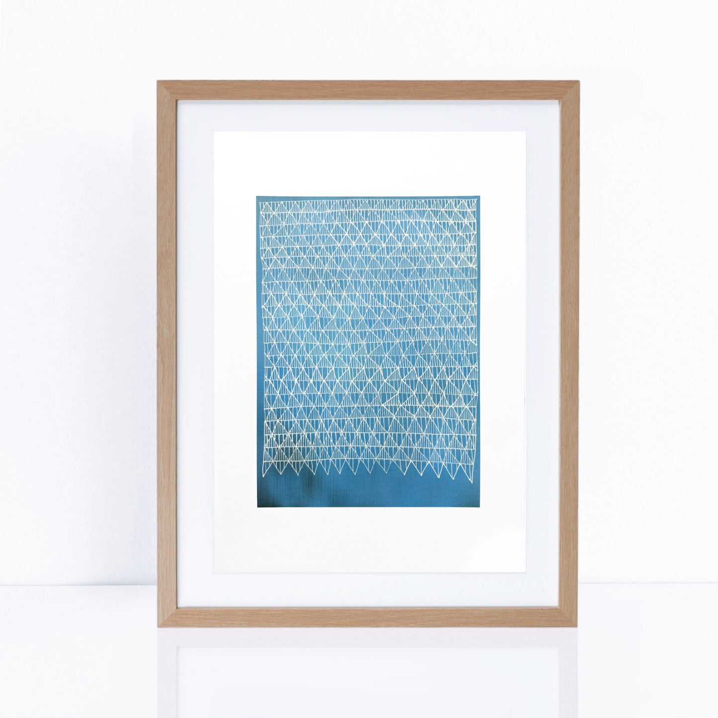 blue artwork in frame with line patterns