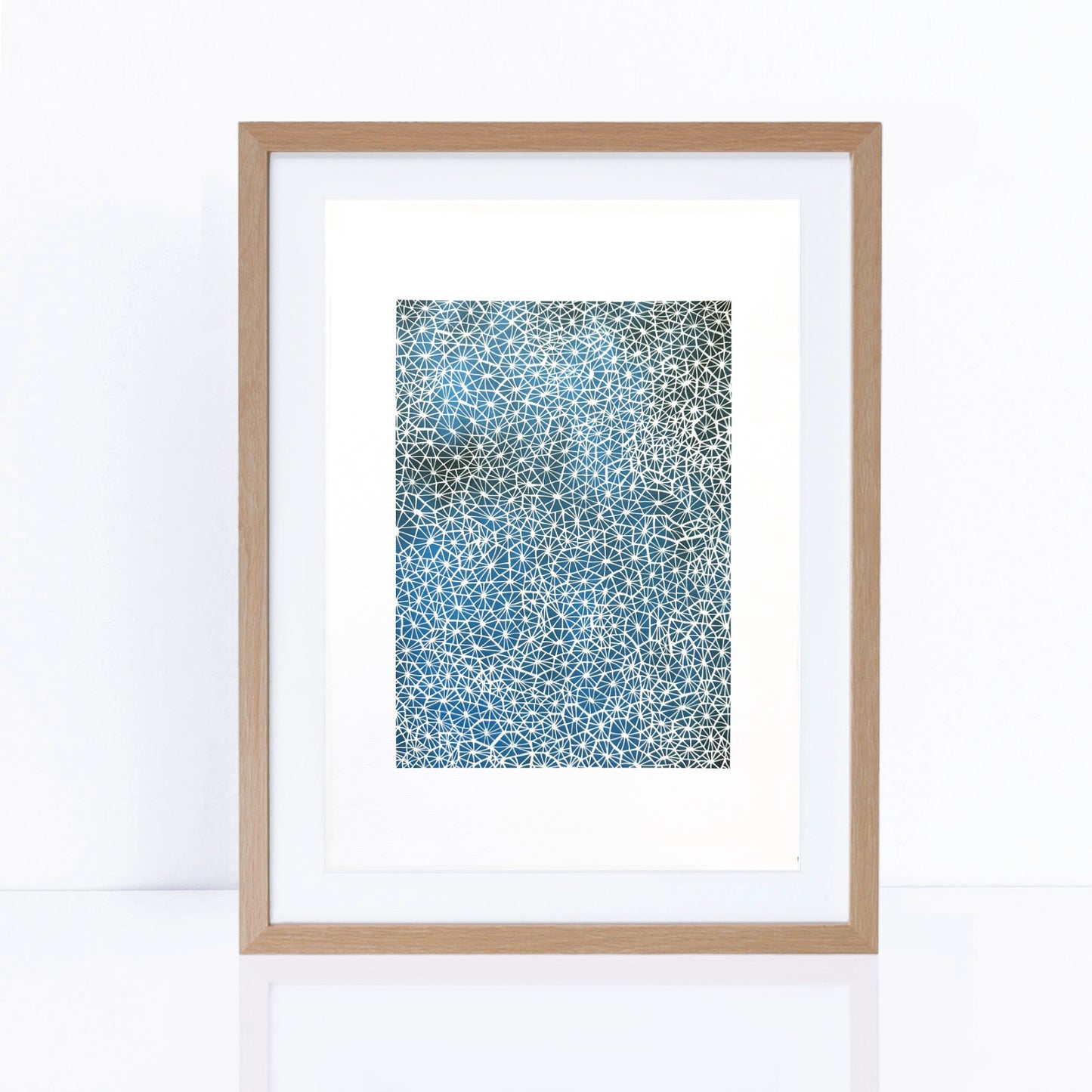  blues artwork with delicate white details patterns in frame