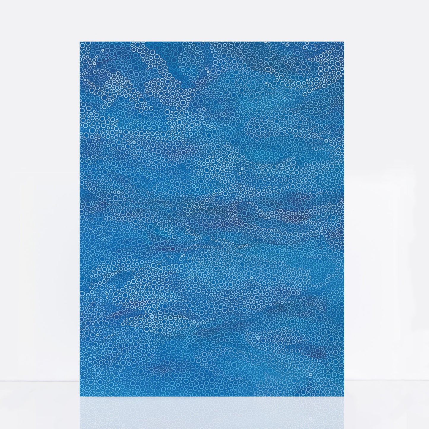 Large blue abstract painting with hand-drawn circular patterns inspired by waves and the sea, layered in tones of ocean blue