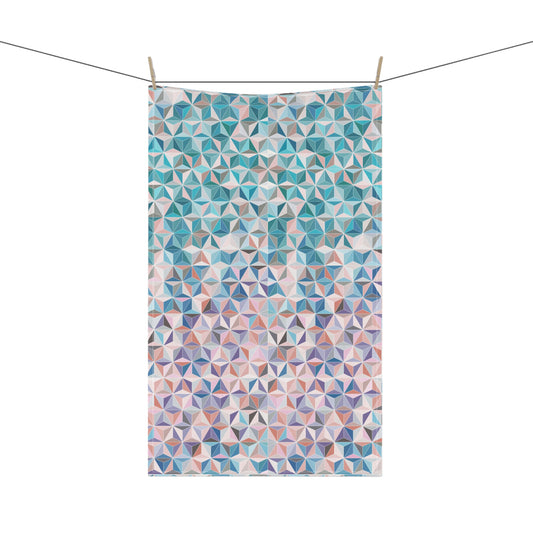 colourful tea towel, with a stunning pattern of interlocking triangles in beautiful pinks, blues and turquoise