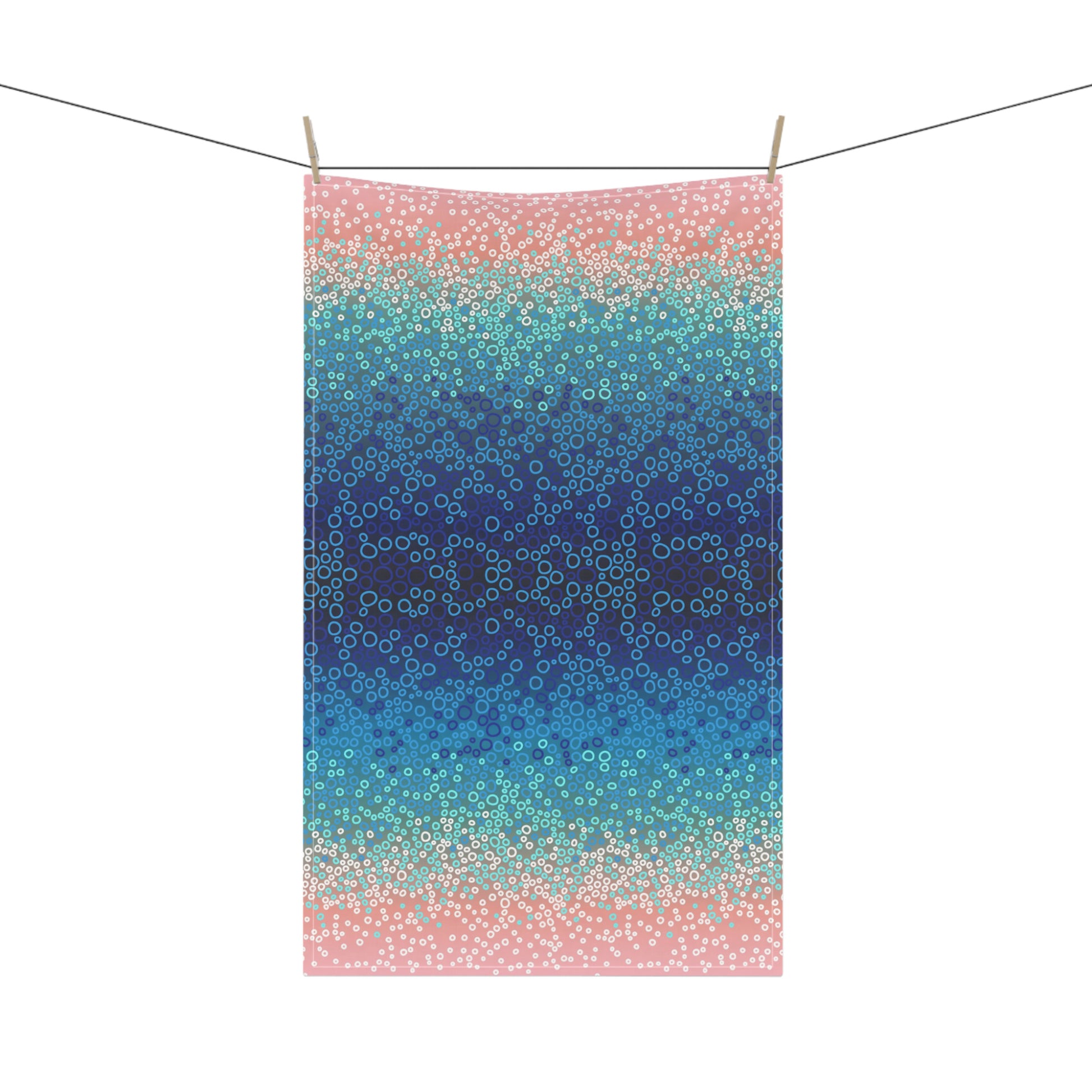 tea towel, featuring a mesmerising gradient of blues, turquoise, and pinks with intricate circular patterns