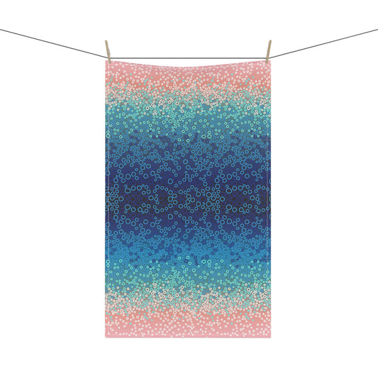 tea towel, featuring a mesmerising gradient of blues, turquoise, and pinks with intricate circular patterns