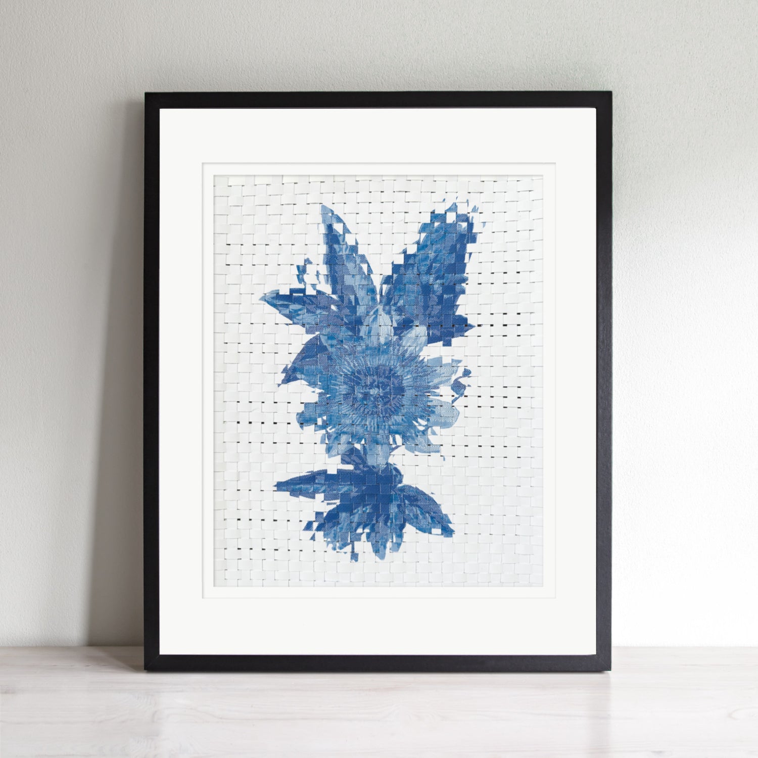 Artwork of a blue passionflower design woven and on a white background