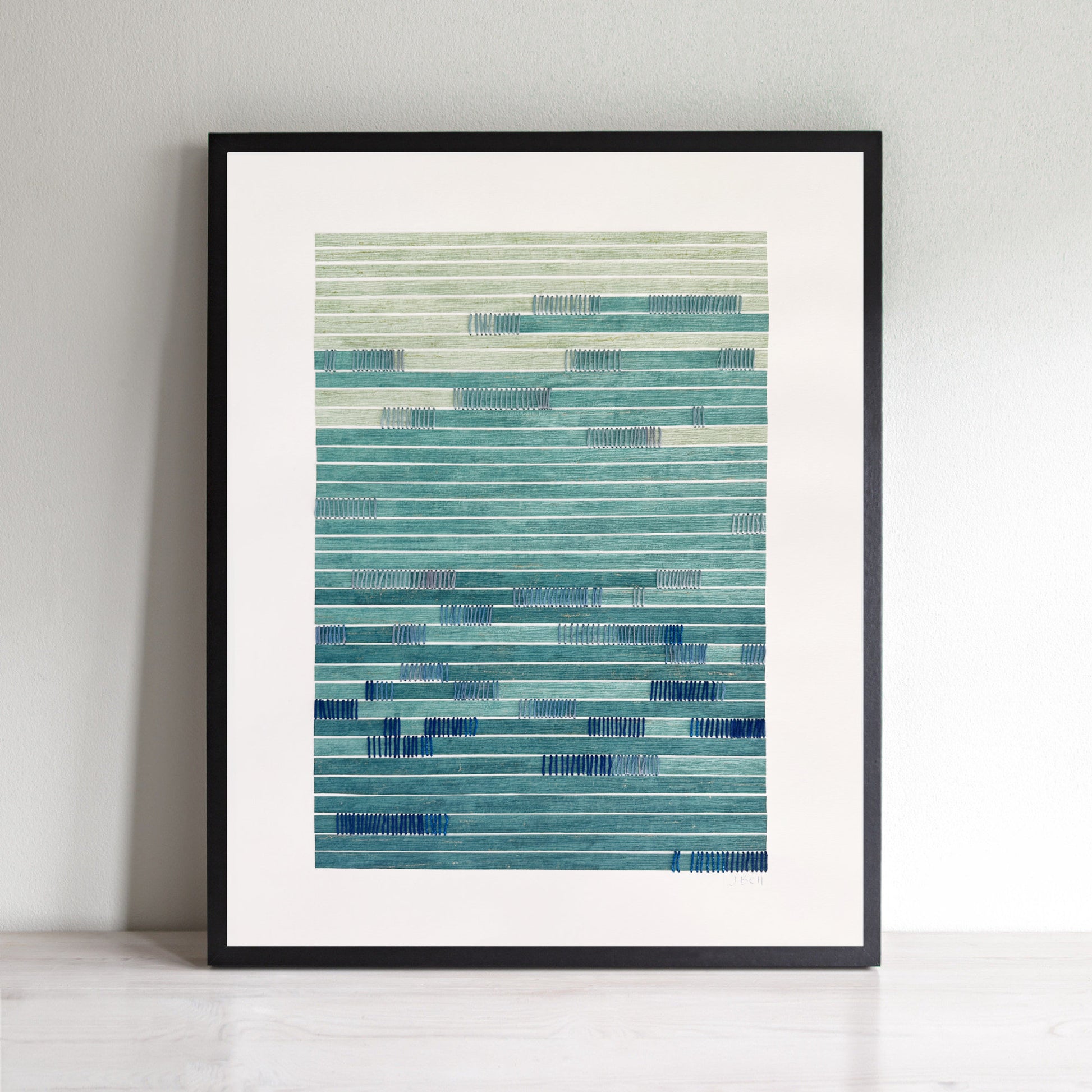 blue abstract wall art with blue and green stripes on a white wall