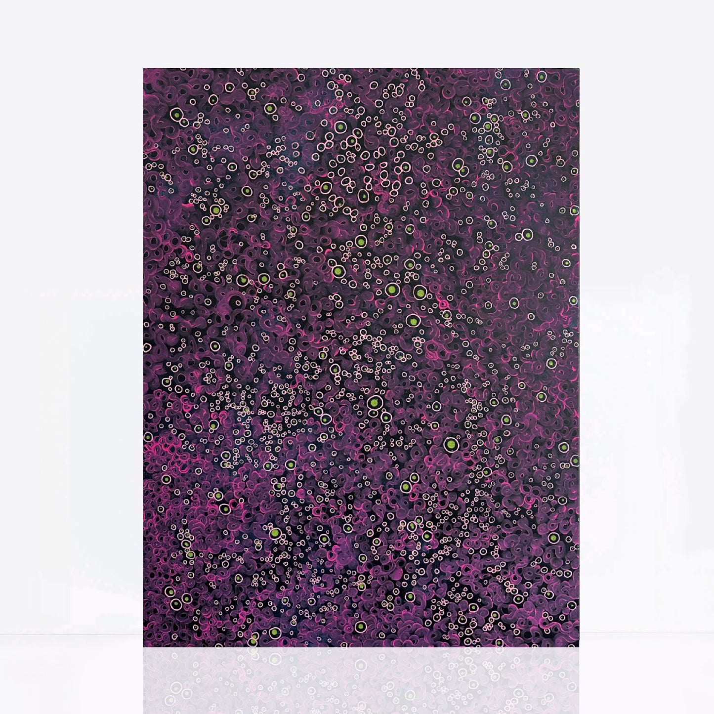 Abstract painting with a dark blue background filled with intricate, bubble-like circles in shades of pink, purple, and hints of lime green. The circular patterns create a textured, cosmic effect, resembling a microscopic or celestial landscape