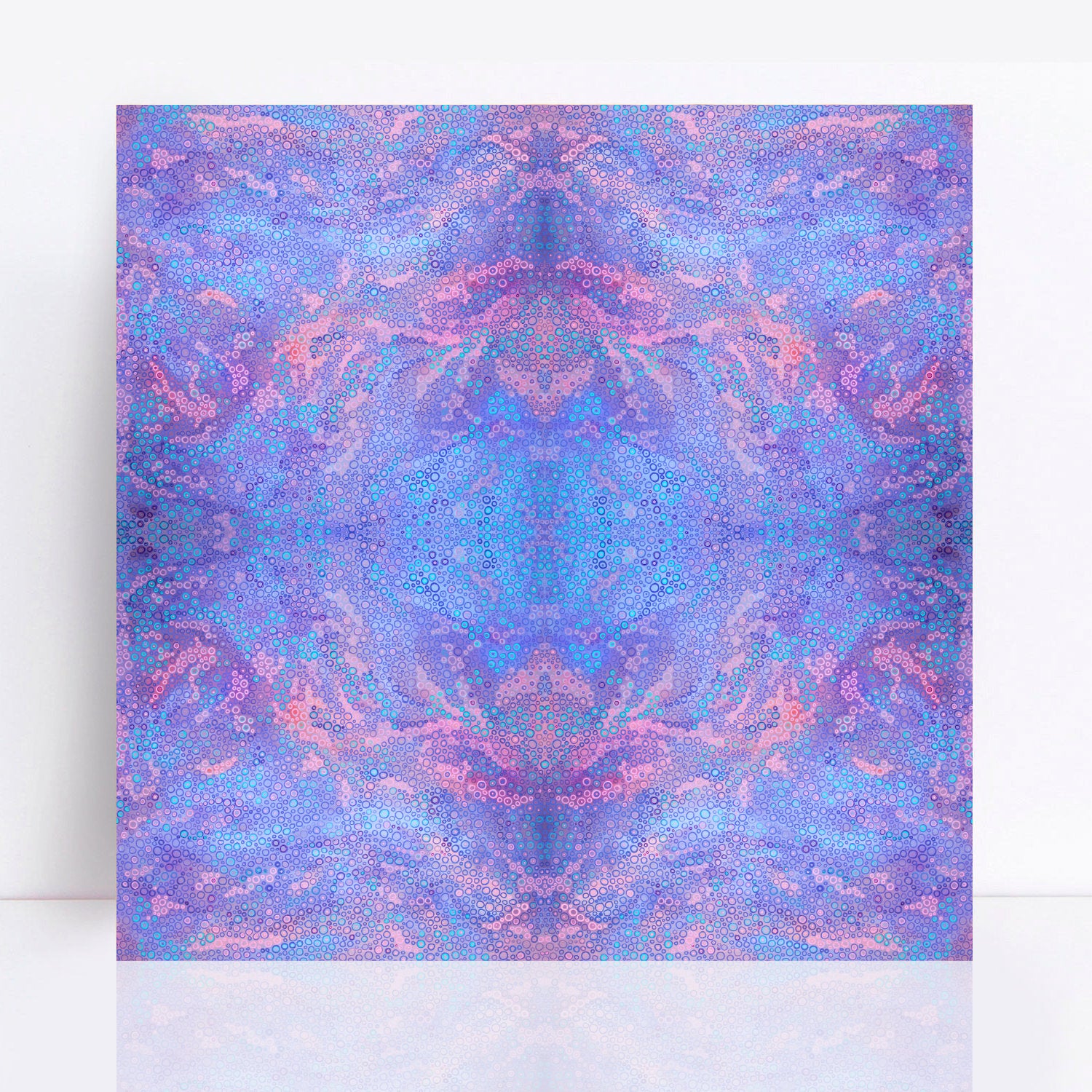 A limited edition print titled "Jacaranda Blue," featuring a colourful abstract design with hundreds of meticulously arranged dots and circles in various sizes. The artwork showcases a harmonious blend of bluish-purple and soft pink tones, inspired by the hues of flowering jacaranda trees. The print is displayed against a white background, highlighting its intricate and captivating design.