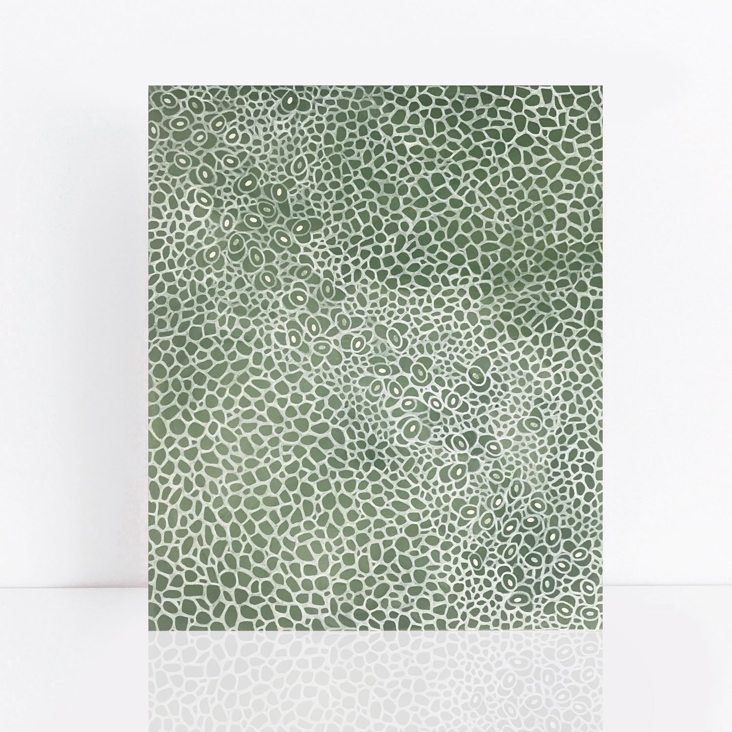 green painting with cut paper organic pattern
