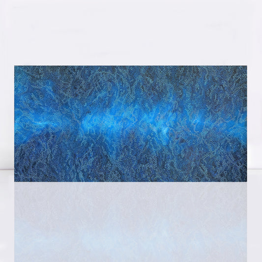 Ocean Break is a large abstract painting filled with shades of blue. It features numerous small circles, giving the impression of moving water. The circles are densely packed and vary slightly in size, creating a sense of depth and motion similar to ocean waves. The overall effect is calming and dynamic, reminiscent of the sea's natural rhythms.