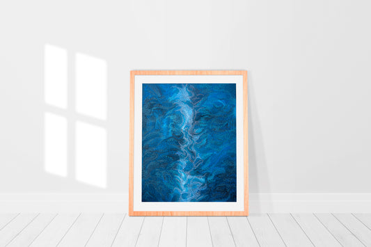 print in a frame of blue abstract painting reminiscent of a breaking wave on the ocean 