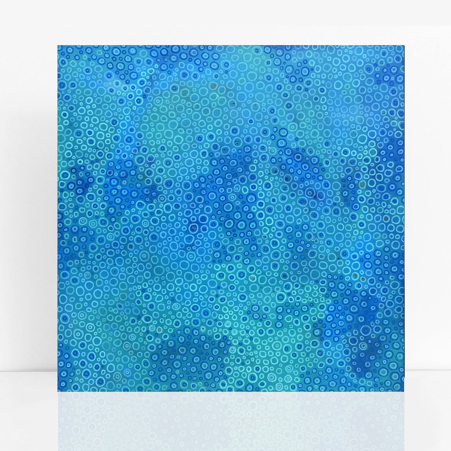 abstract painting in a mix of blues and turquoise, with tiny hints of gold