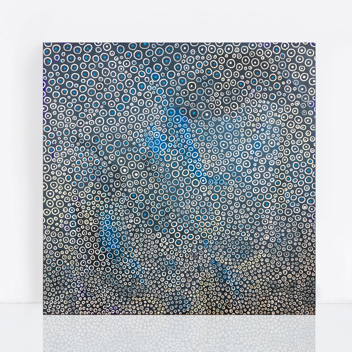 abstract dot painting in blues and cream like underwater