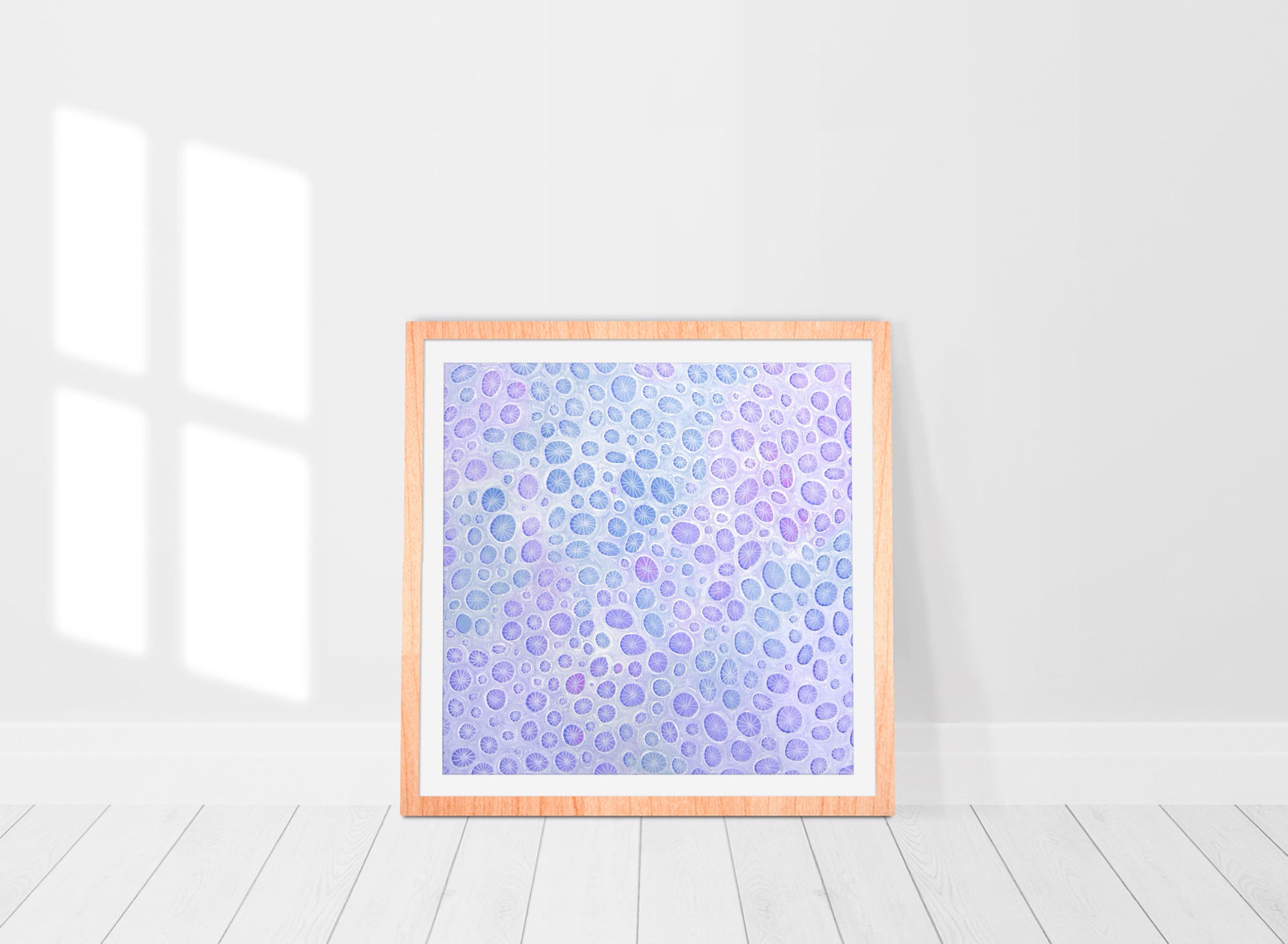 framed abstract print in a mix of blues and purples