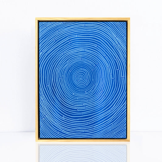blue and white framed abstract painting of a woven basket