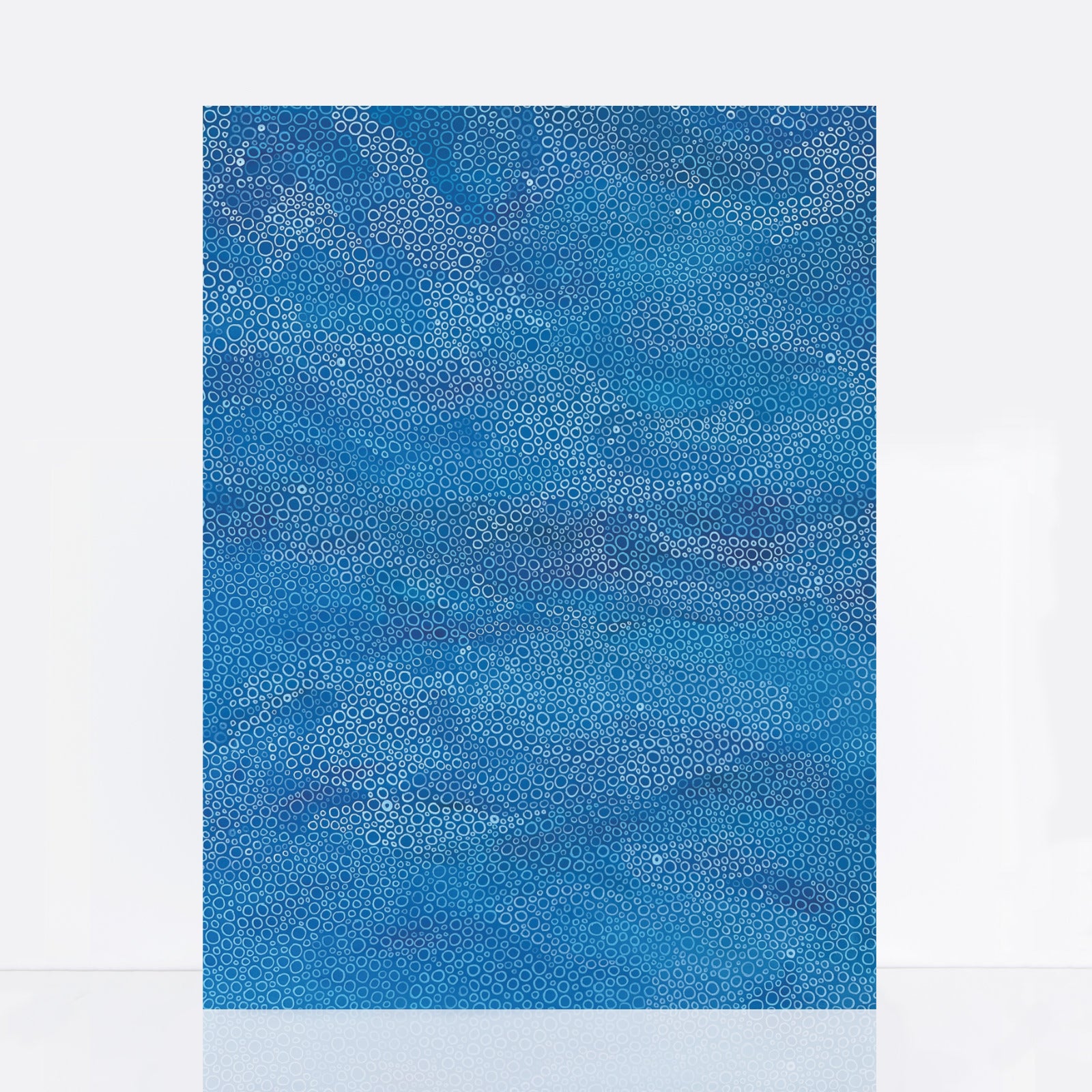 Large blue abstract painting with hand-drawn circular patterns inspired by waves and the sea, layered in tones of ocean blue