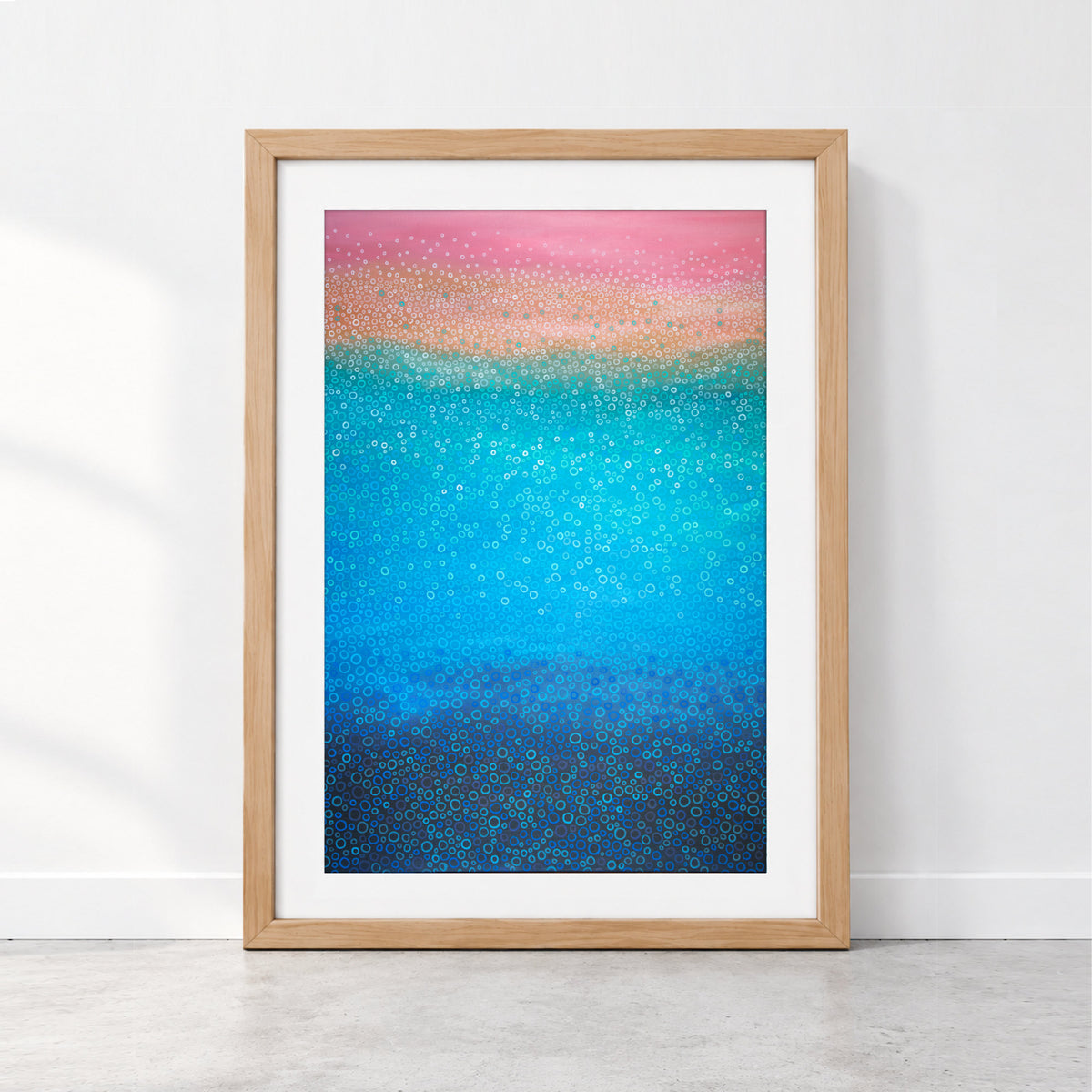Colourful coastal abstract art with hundreds of hand-drawn circles in pink, coral, turquoise and deep blue, inspired by bubbles and ocean water.